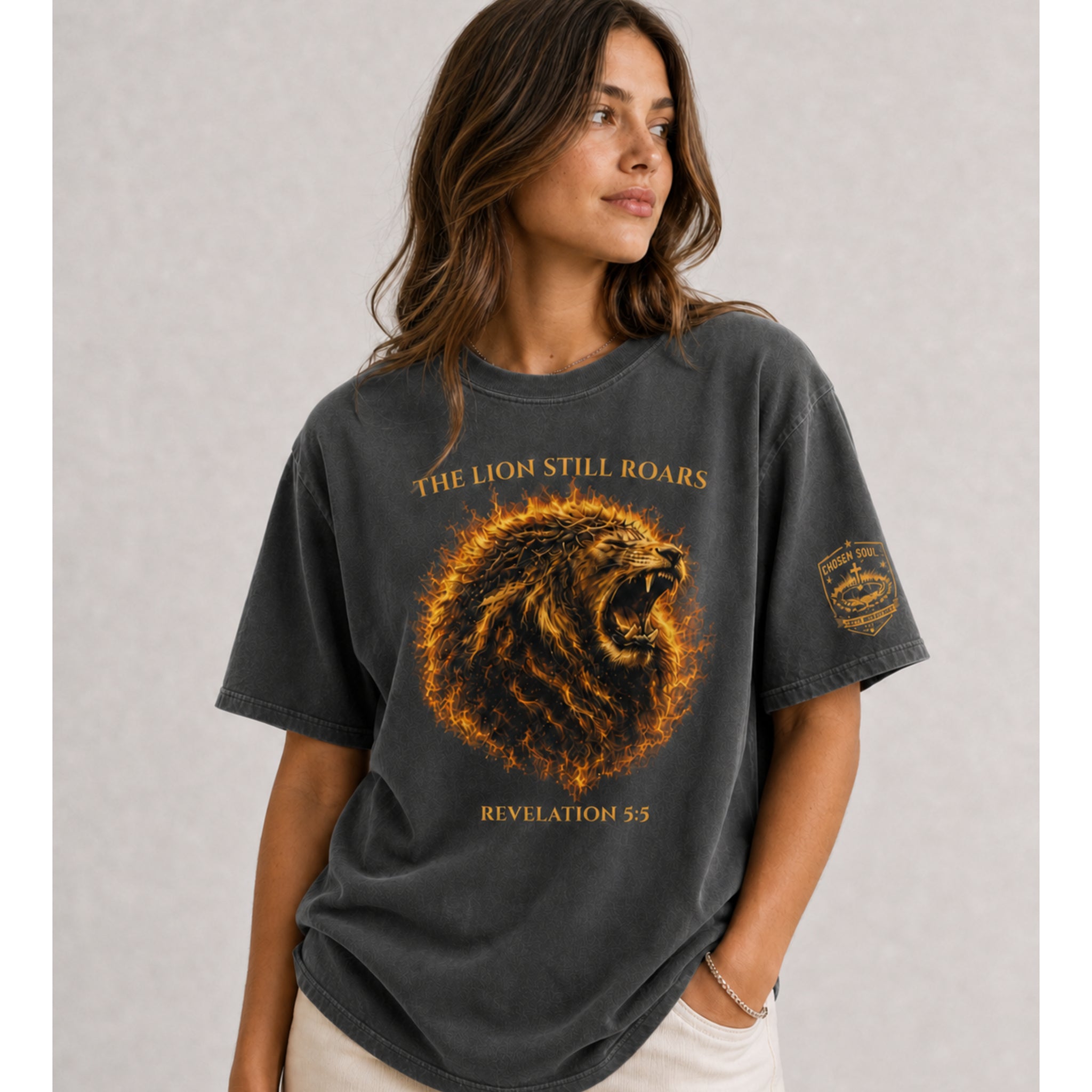 Man wearing a Pepper The Lion Still Roars Revelation 5:5 Christian T-shirt in the mountains